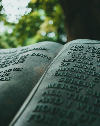 Ancient scroll with Sanskrit text against a dark, textured background.