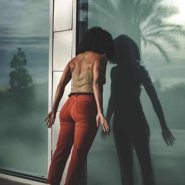 Silhouette of a person at sunrise, looking energized and ready for the day.